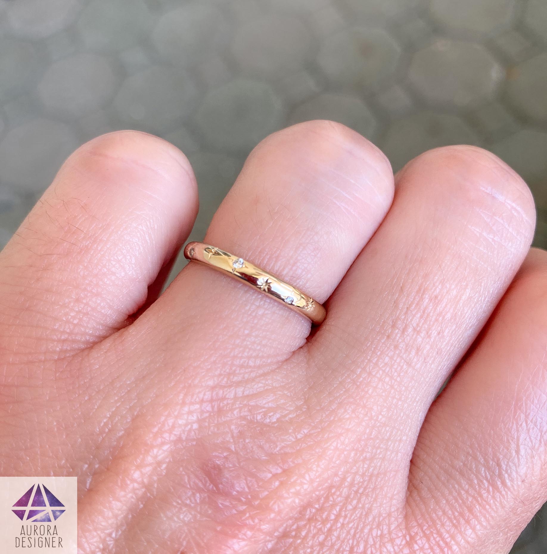 yellow gold engagement ring on finger